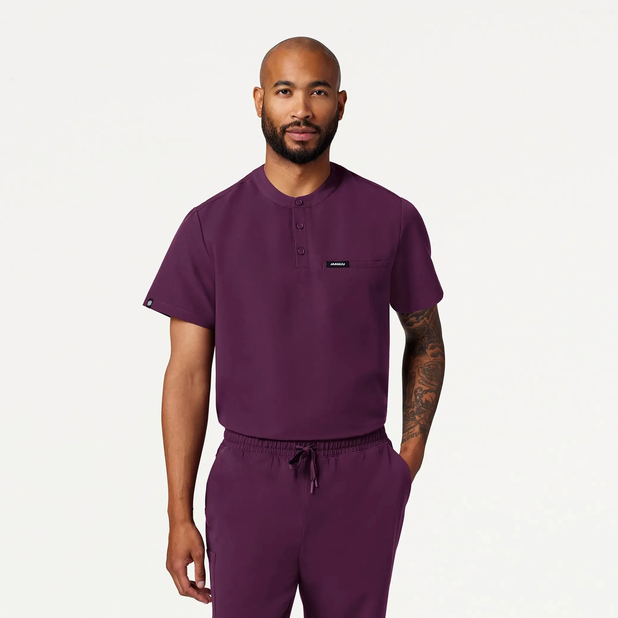 Jaanuu Men's Reeve Henley Scrub Top - Dark Amethyst