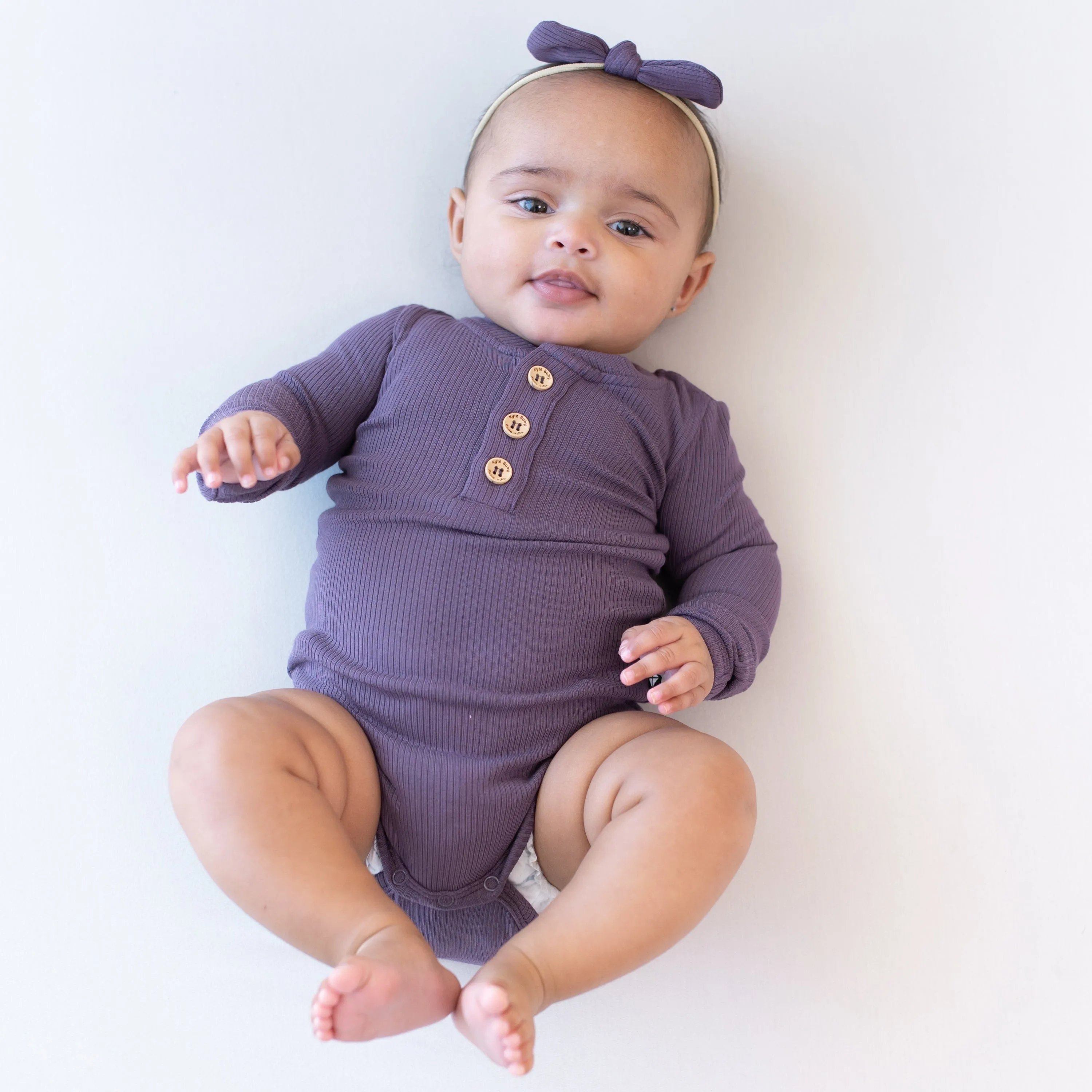 Ribbed Long Sleeve Henley Bodysuit in Currant